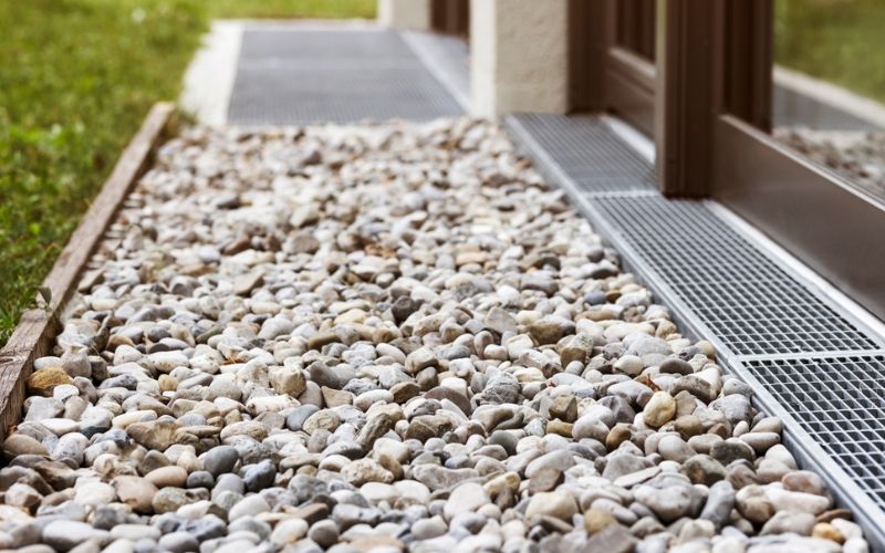a walkway with rocks and gravel on it.